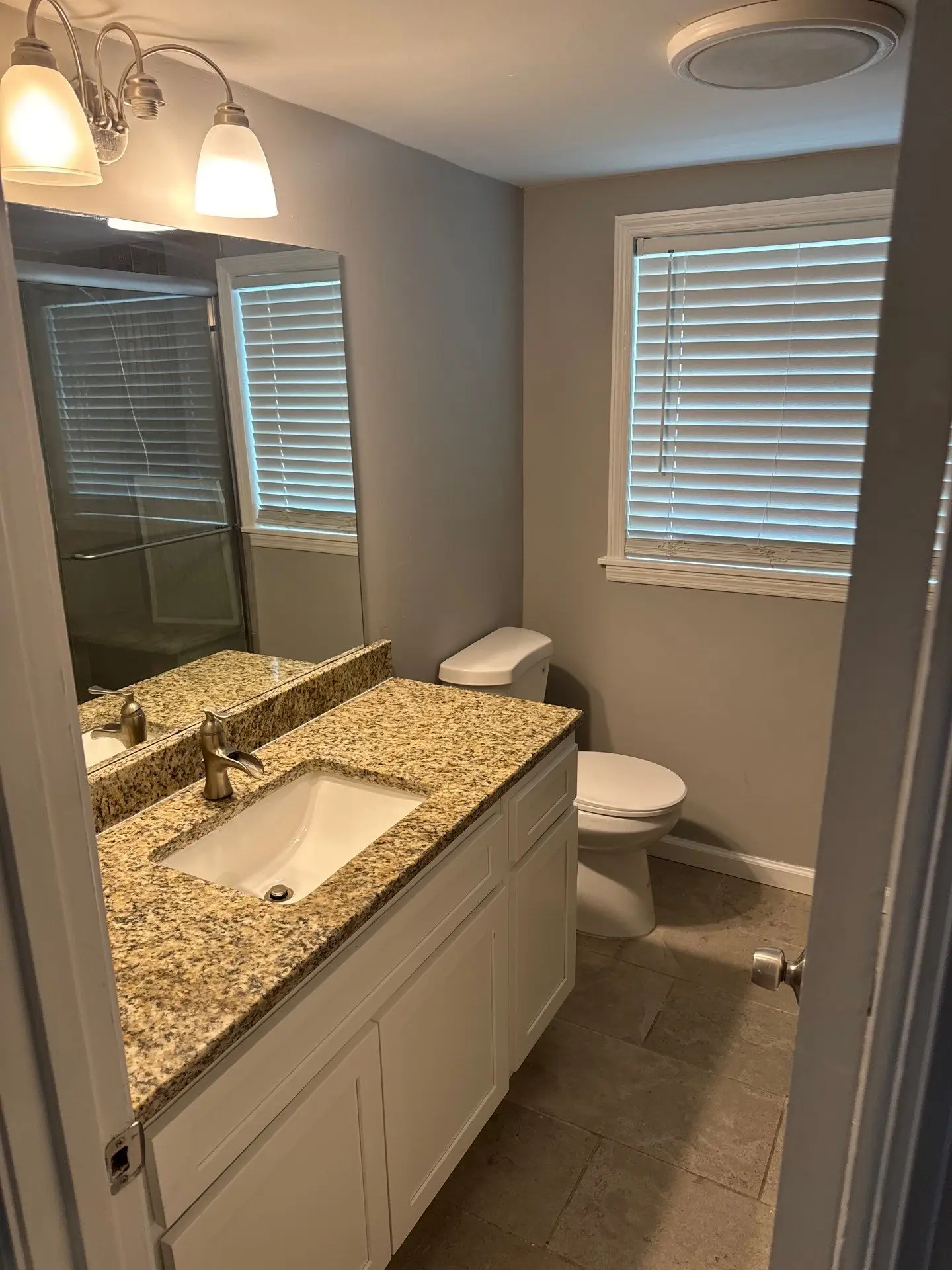 Newly installed LVP flooring and fresh drywall trim in a renovated interior space.