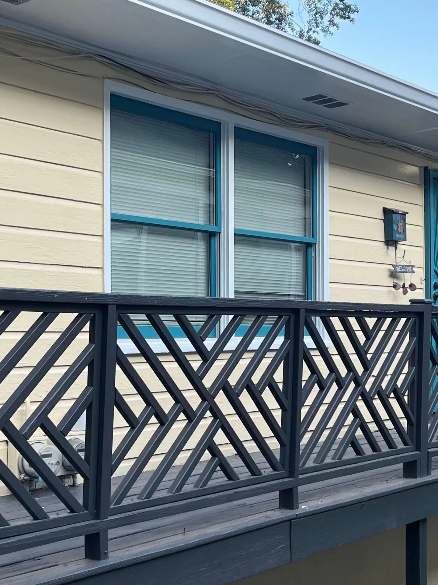 New, white Dyke Industries wood sash pack installed cleanly into the original wood window frame with visible Low-E glass.